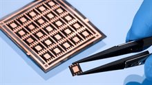 Additive fan-out package between tweezers