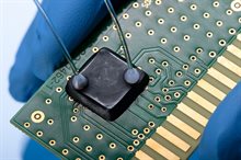Overmolded chip sample with micro-fluidic cooling