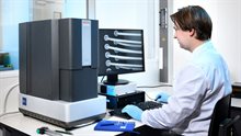 Researcher working with electron microscope