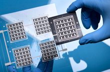 CITC researcher holding samples of a new chip packaging concept