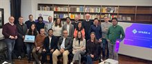 SPARK-e kick-off meeting: 19 people standing in a library