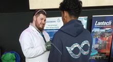 Scientist talking to a young student at a career festival