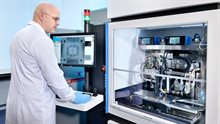 Researcher operating a pick and place machine for semiconductors