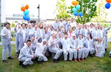 People in lab suits celebrating the opening of CITC
